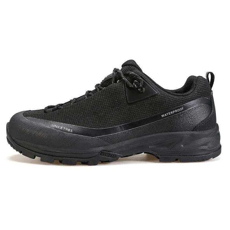 Men's low-top casual hiking boots in black with leather mesh upper and lace-up front.