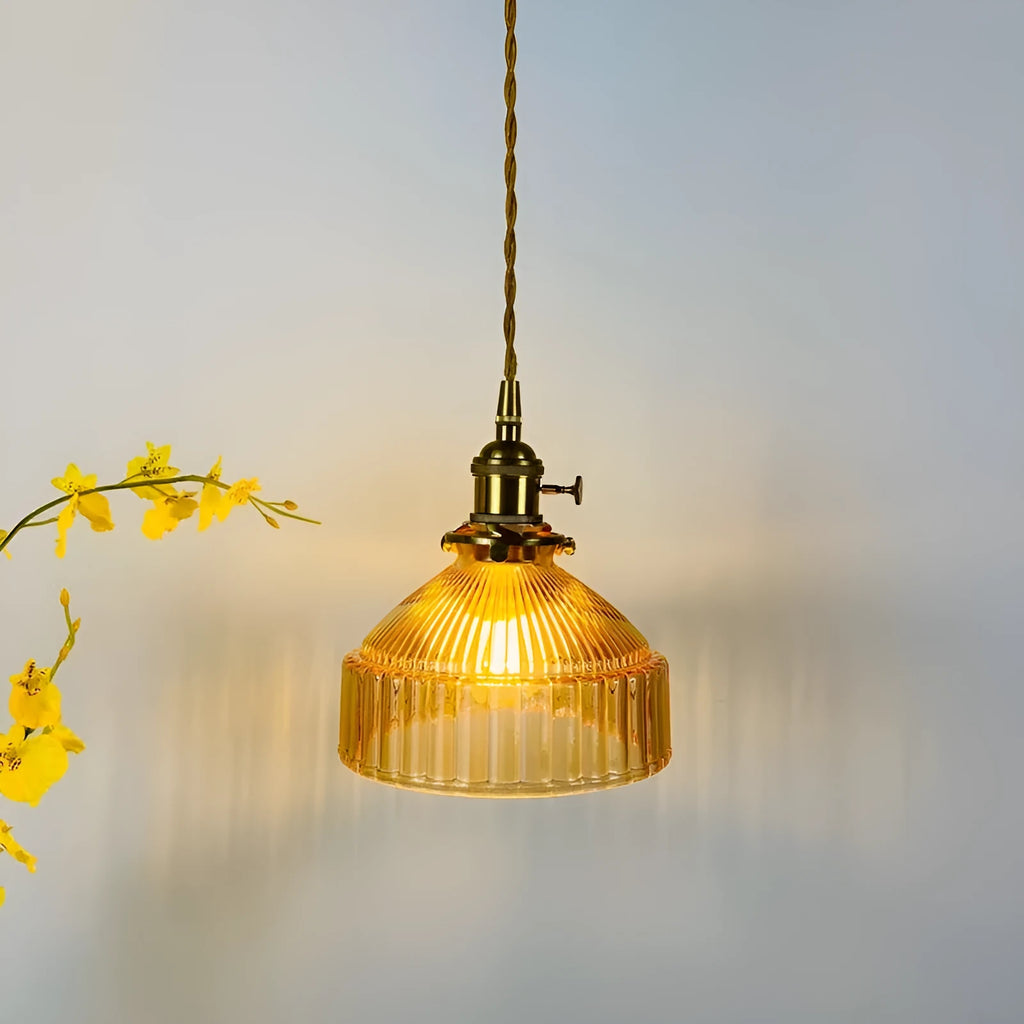 Brass and glass ceiling chandelier light with an adjustable suspension wire.