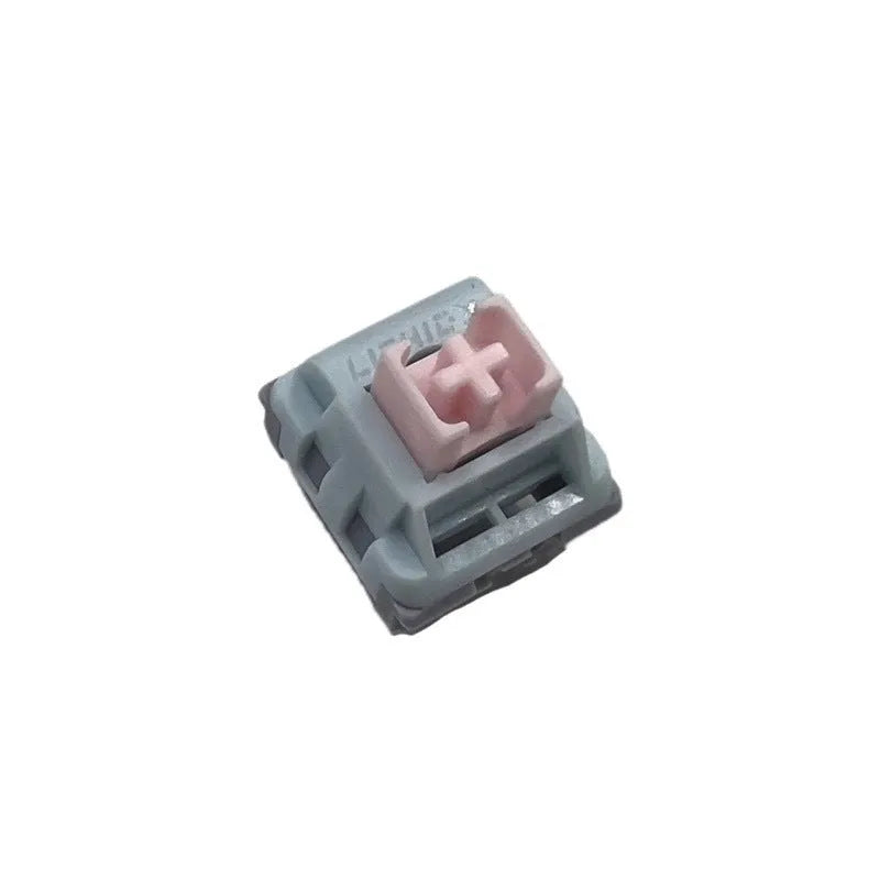 Four mechanical keyboard switches with small window design and dew axis colouration showing internal components