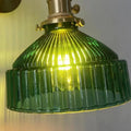 Brass and glass ceiling chandelier light with an adjustable suspension wire.