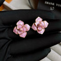 Purple and gold flower stud earrings with oil-spot glaze finish on copper bases