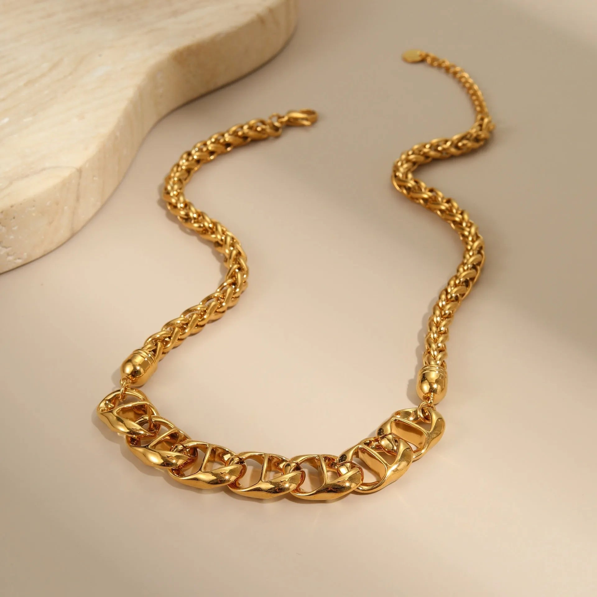 Stainless steel geometric pendant necklace with 18K gold plating in gold and steel colour options.