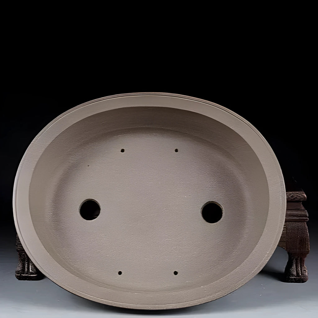 Handmade antique oval purple sand ceramic bonsai pot measuring 25cm by 21cm by 6.3cm