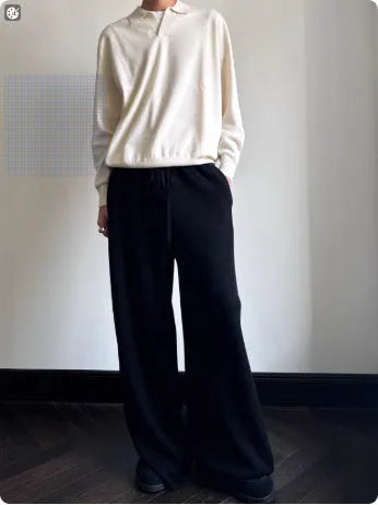 Pure wool lapel-collar polo sweater in a loose fit, shown in milky white.