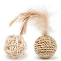Two cat toys: a hollow rattan ball and a faux feather ball on a plain background