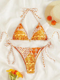 Women's green split bikini swimsuit with bandage-style printed stitching and briefs bottom.