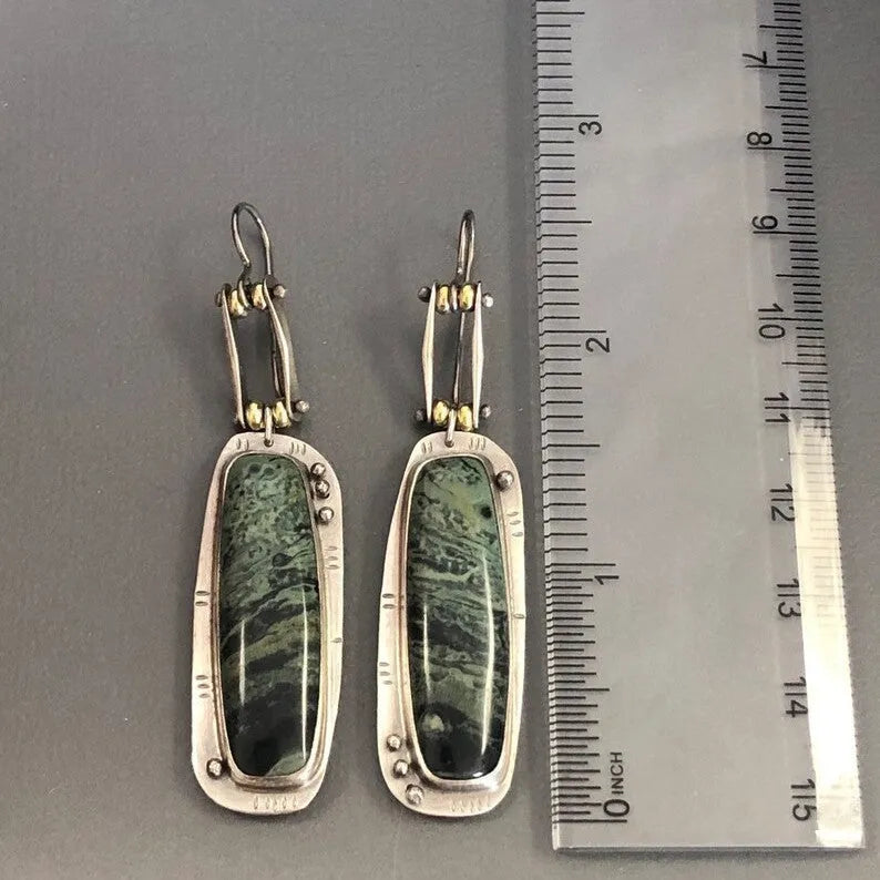 Women's geometric drop earrings with a two-colour marble pattern on alloy metal.