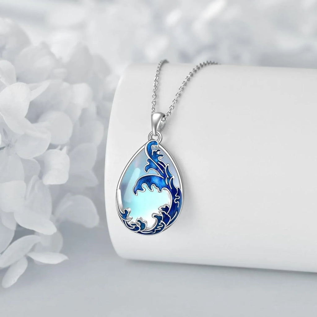 Moonstone blue alloy heart pendant necklace with chain on white background