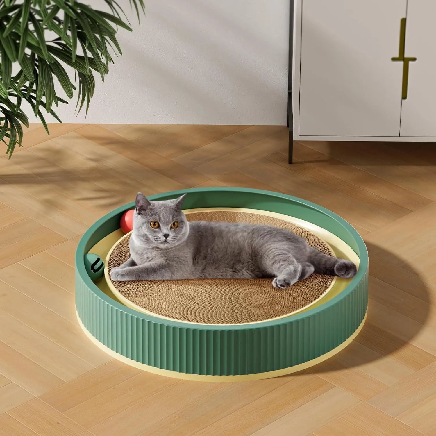 Large circular cat scratching board with replaceable cardboard centre and integrated ball toys