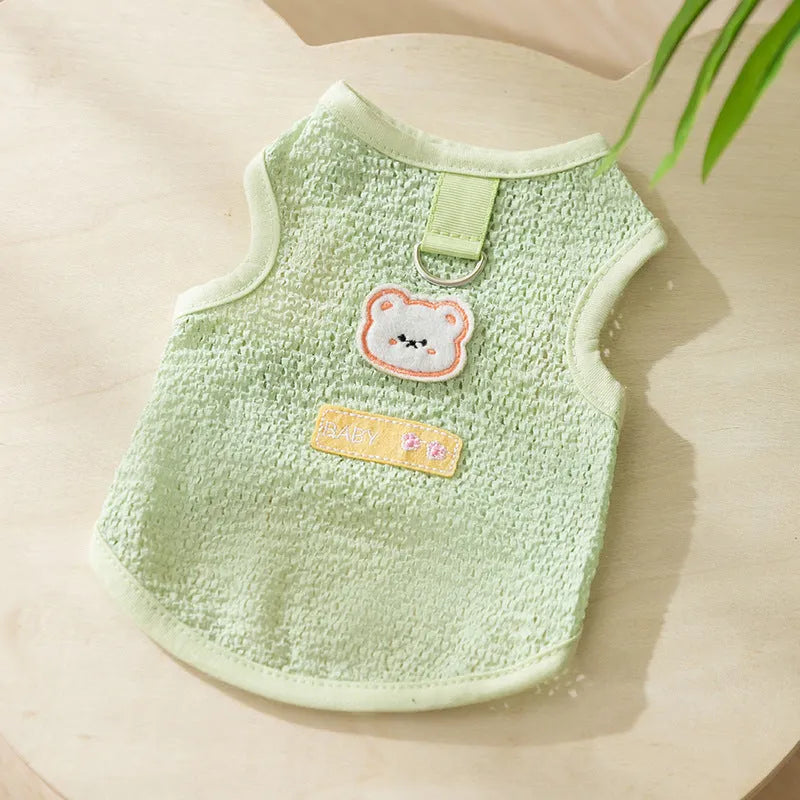 Blue knitted cat clothing with a bear patch, showing hollowed-out breathable design