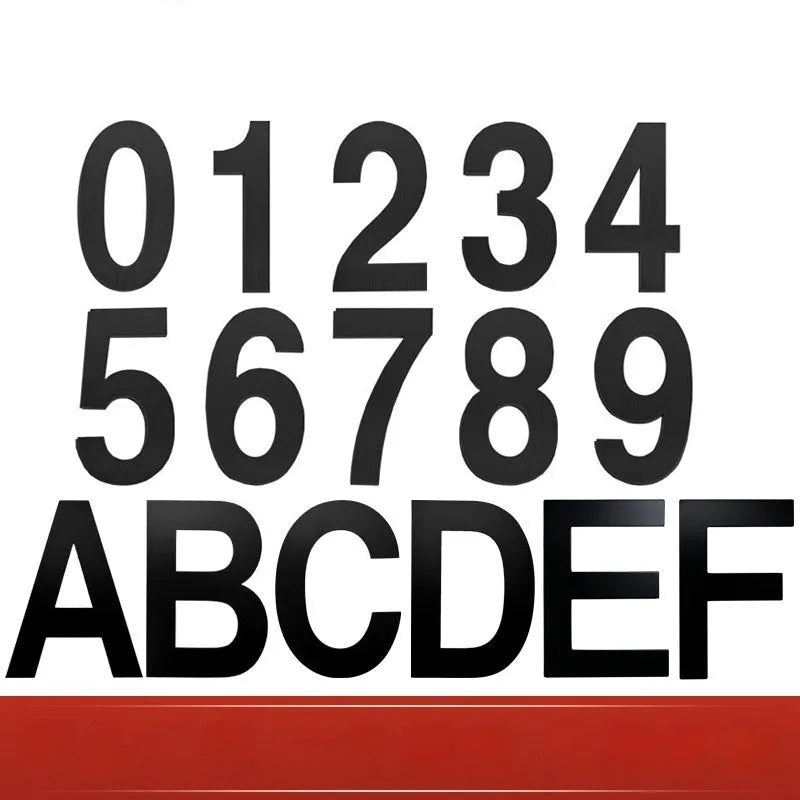 Black stainless steel sticky house number showing 7.5cm height on a door.