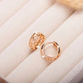Rose gold leaf-shaped earrings with heart cut-outs, 20mm copper jewellery