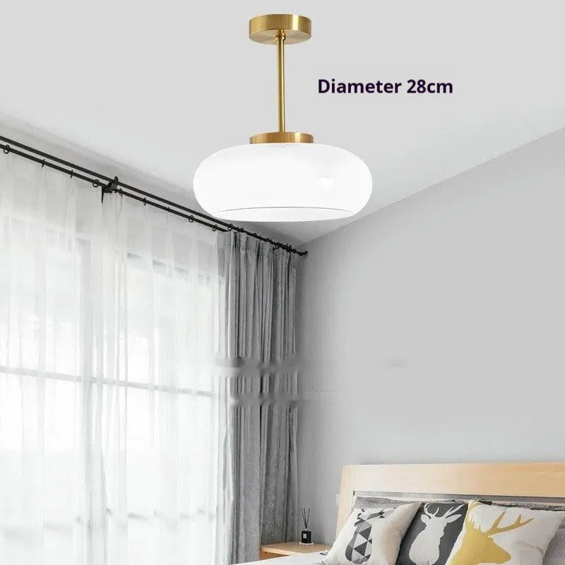 Bauhaus style three headed egg tart pendant light with glass shades in milky white finish