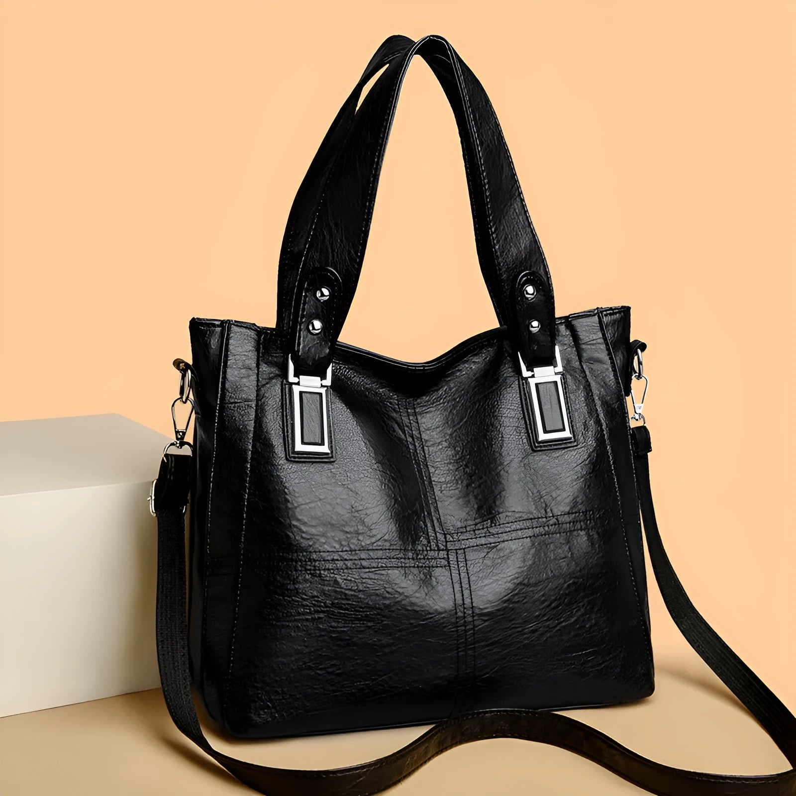 PU women's handbag in black with horizontal square shape and sewing thread details