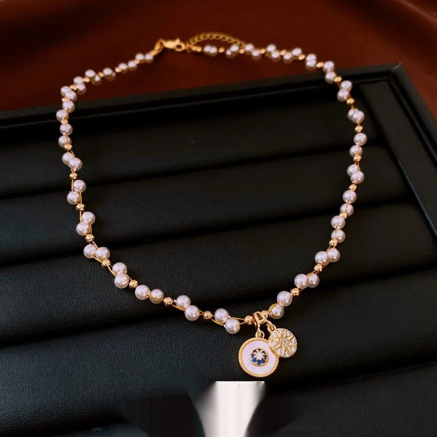 Women's gold electroplated necklace with round zircon-inlaid imitation pearl pendant on clavicle chain