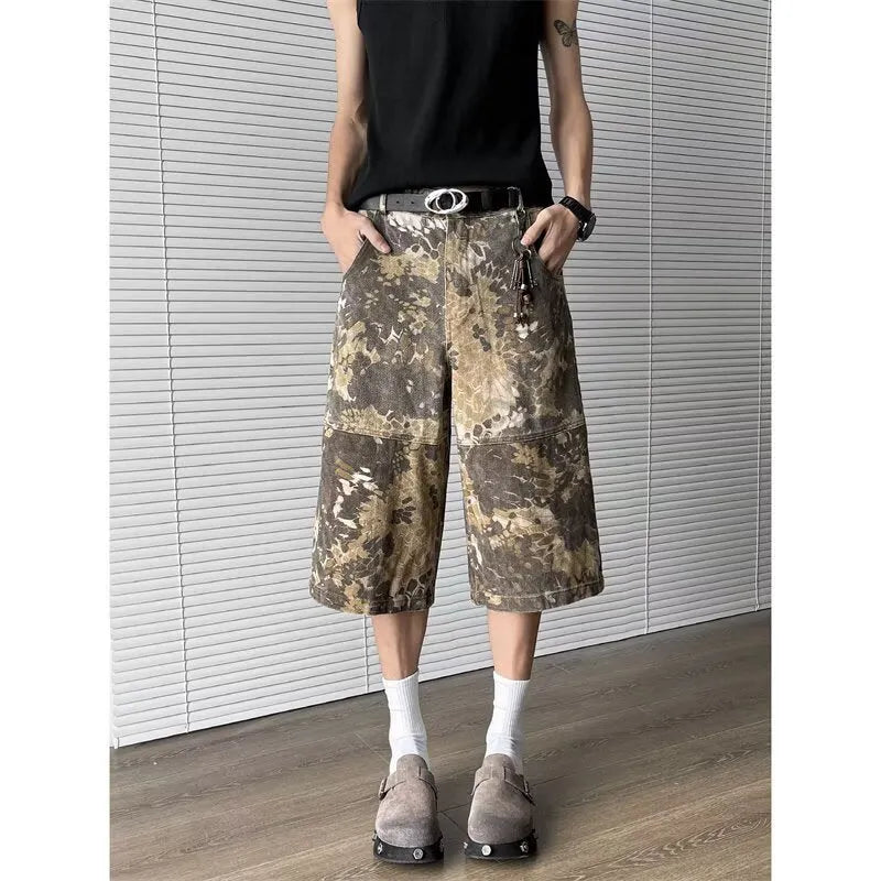 Yellow snake pattern camouflage cropped jeans on a denim background