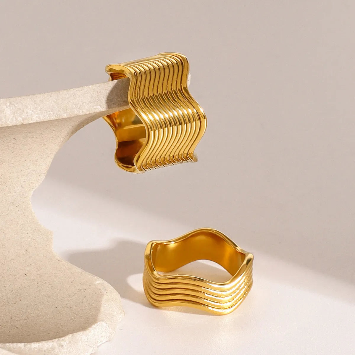 Stainless steel geometric wave ring with wide surface and electroplated finish