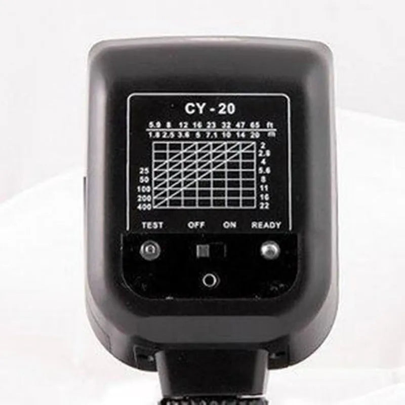 Compact SLR camera flash accessory unit shown tilted on a camera hot shoe, showcasing its 90-degree adjustable head.