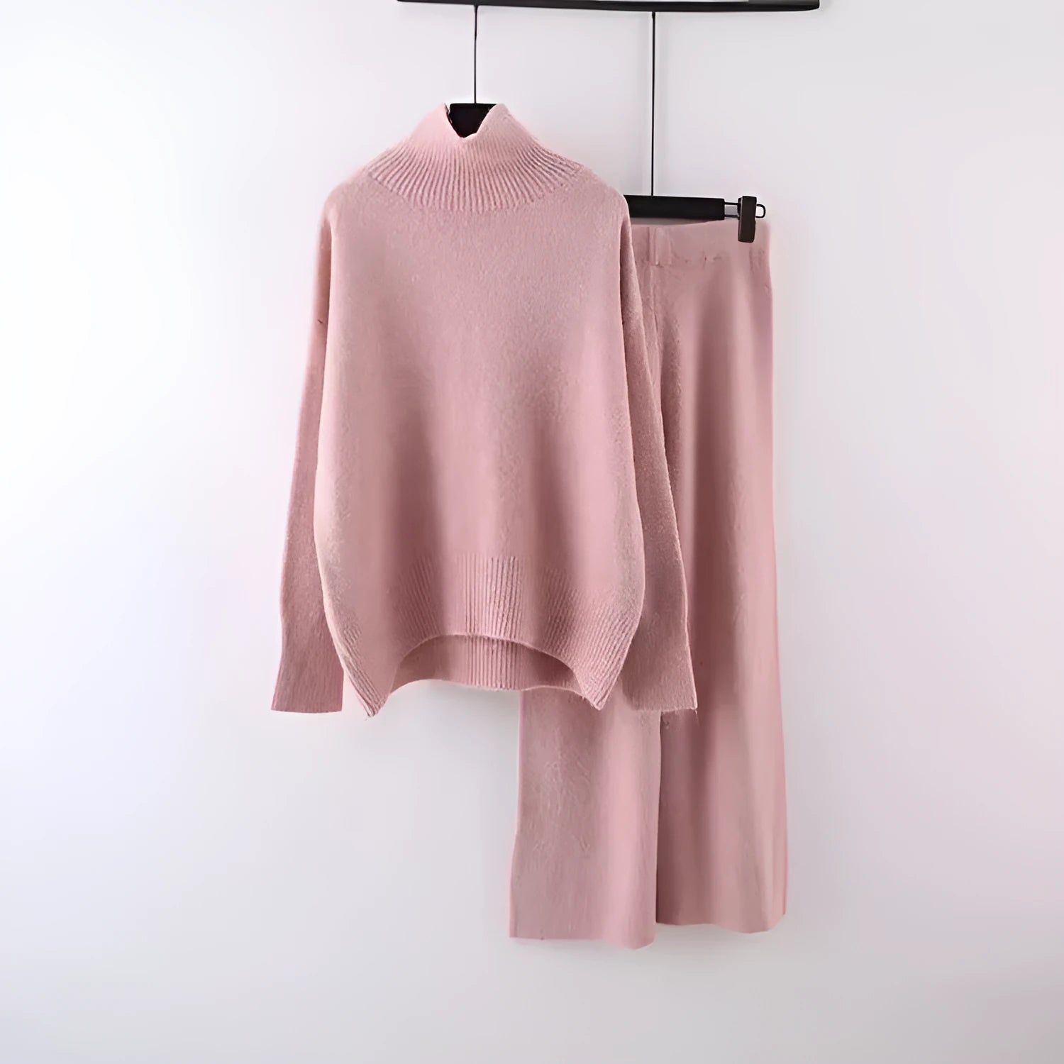 Women's casual two-piece set with an acrylic sweater and wide-leg trousers in a solid colour.
