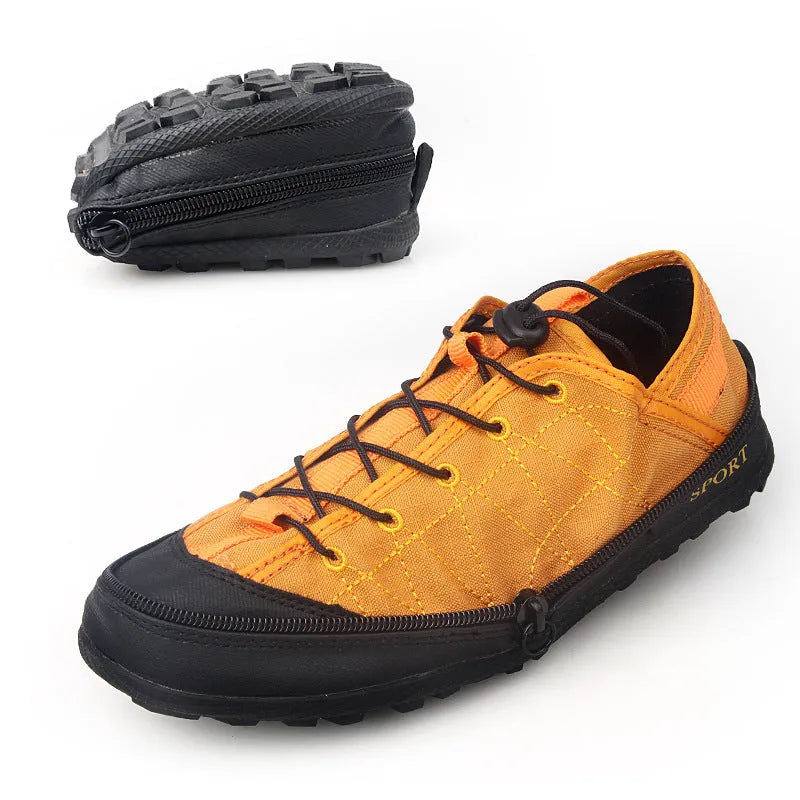 Orange portable folding outdoor shoes with a side zipper closure on a grey background