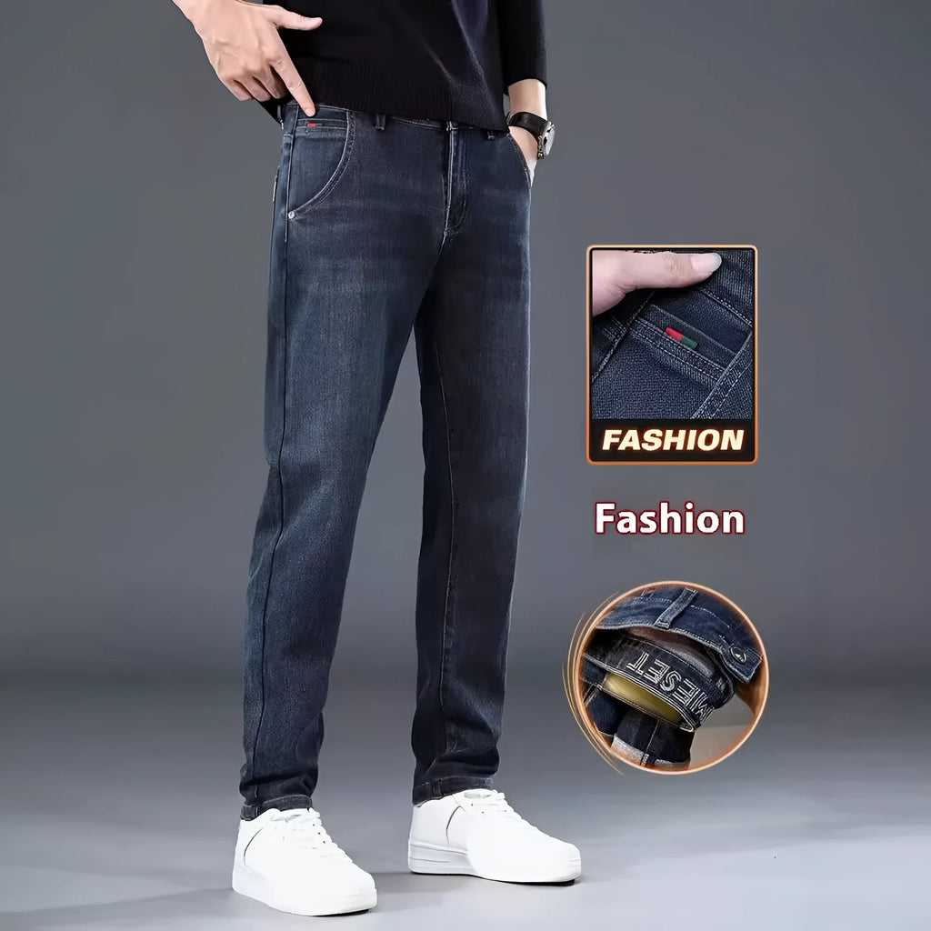 Blue grey slim straight leg casual trousers on a hanger, showing the mid-rise waist and zipper fly.