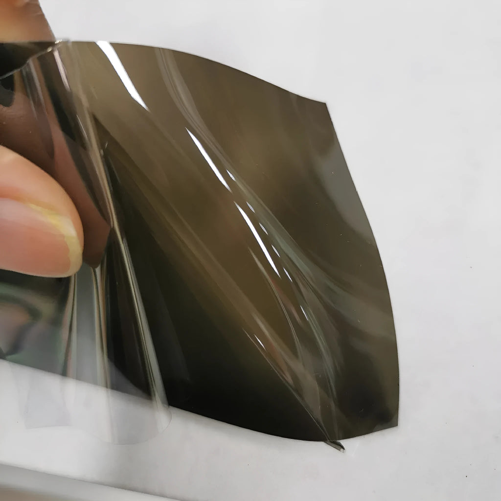 Roll of 30cm wide transparent protective film for car plastic headlamps and tail lights.