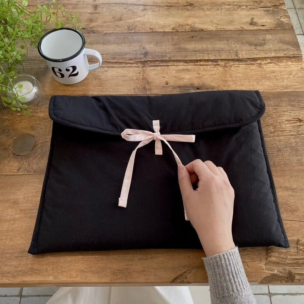 Women's black and white quilted nylon computer bag with ballet bow detail