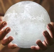 3D printed moon lamp on wooden stand with touch control ring at base, showing white and yellow light colours.