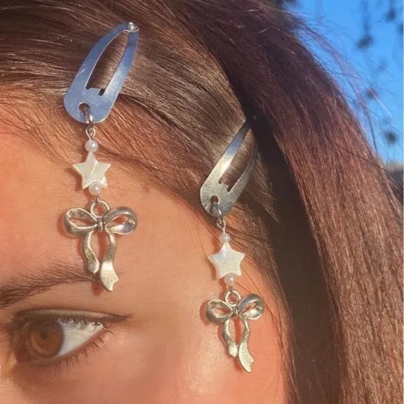 Silver star bow metal hair clip with electroplated finish, single pack