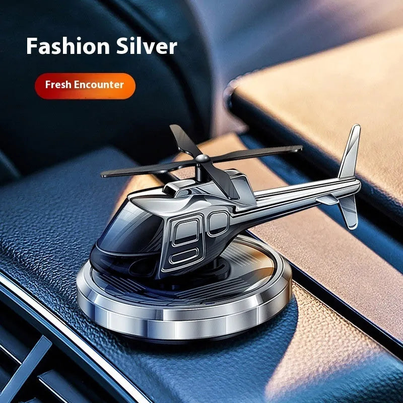 Metal solar helicopter car air freshener with rotating blades in silver, black, or blue colours