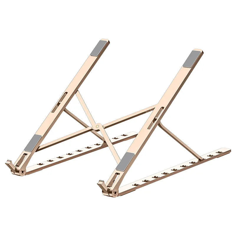 Grey folding aluminium alloy laptop bracket with silicone grip on a desk, angled to hold a notebook