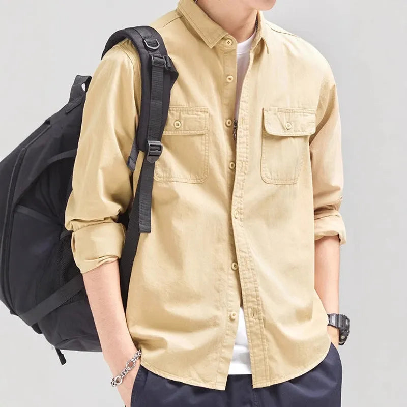 A man's loose-fitting long sleeve cardigan shirt in light grey, black, khaki, or green.