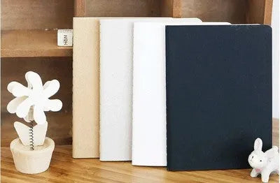 Retro solid-colour A6 graffiti notebook open on a blank page.