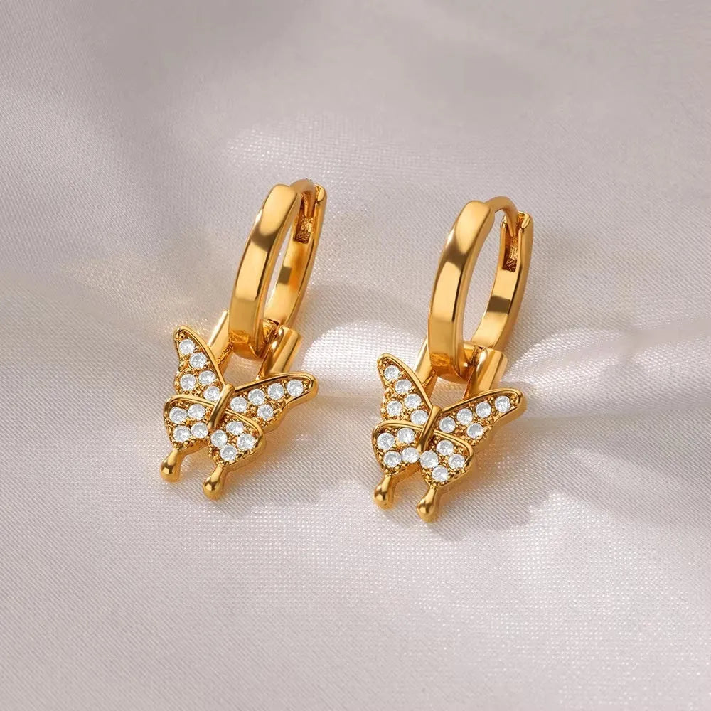 Women's copper earrings with geometric butterfly designs in heart, bow, and star shapes