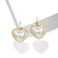 Gold-coloured alloy ear clip for women with natural design metal elements
