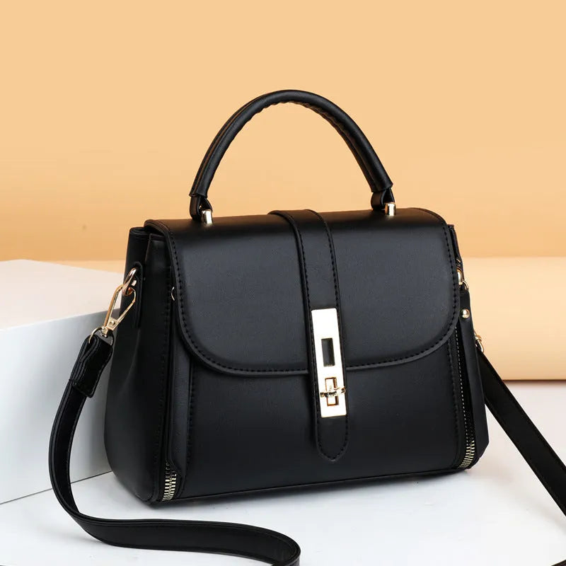 Black soft PU leather women's messenger bag with a single shoulder strap.