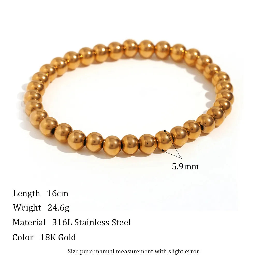 Stainless steel plated elastic bead bracelet with round geometric beads in gold finish