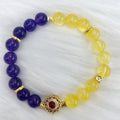 Handmade women's bracelet with yellow and purple crystal amethyst stones on adjustable clasp