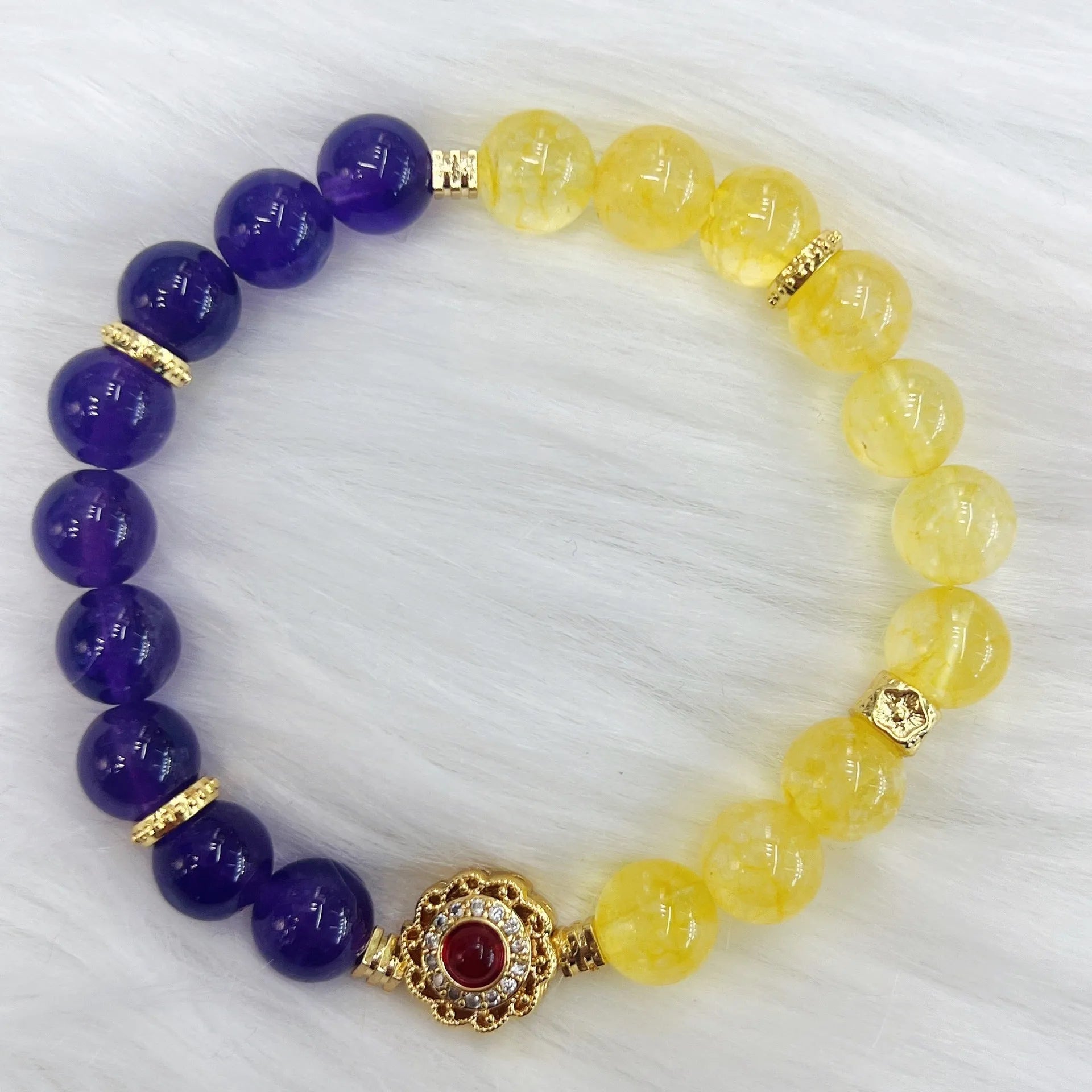 Handmade women's bracelet with yellow and purple crystal amethyst stones on adjustable clasp