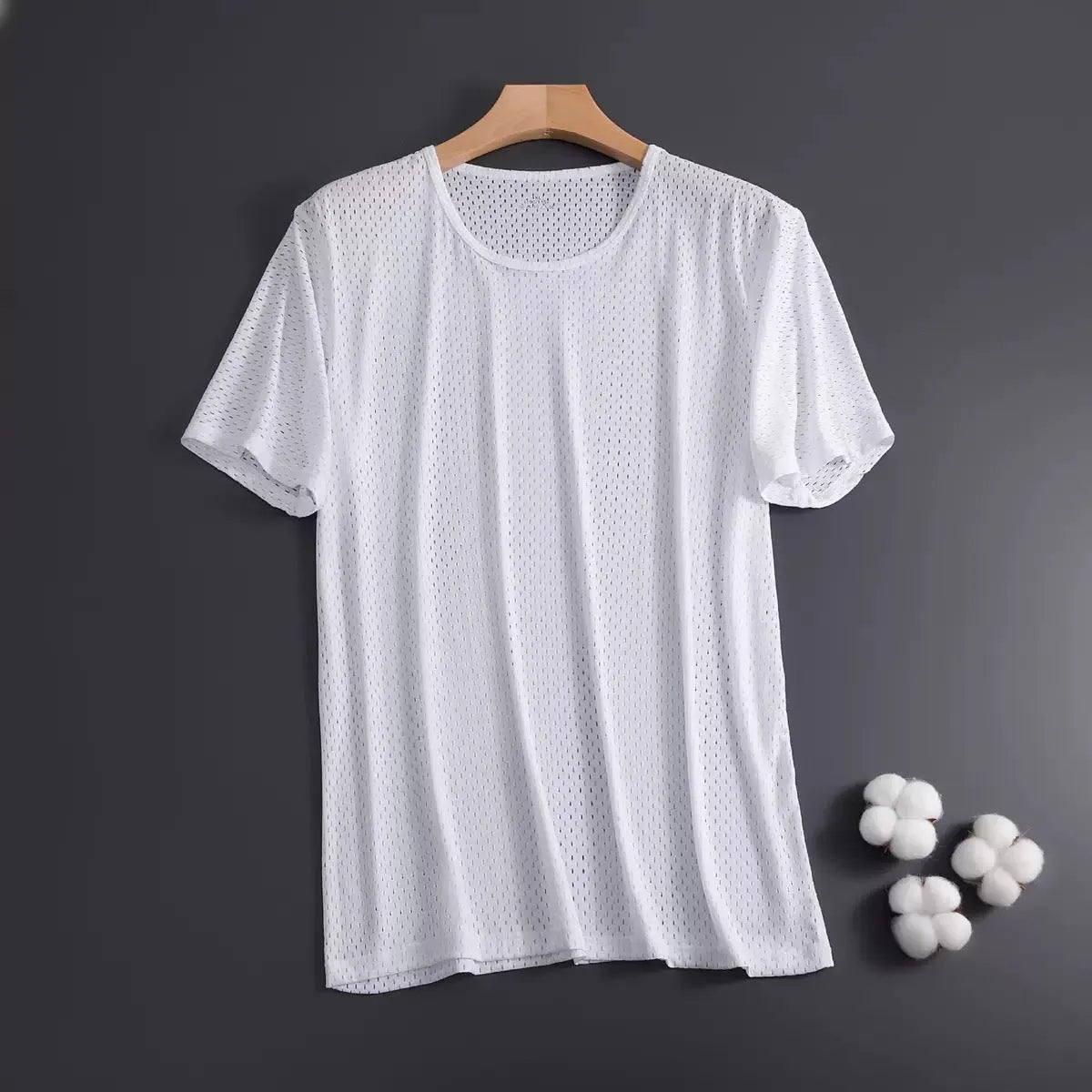 Man wearing a solid colour ice silk short sleeve crew neck T-shirt.