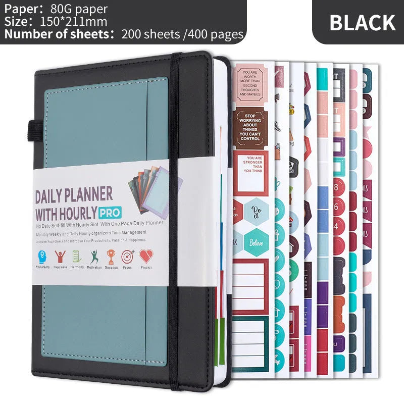 A6 self-filled notebook with PU cover in various colours, shown open on wooden table.