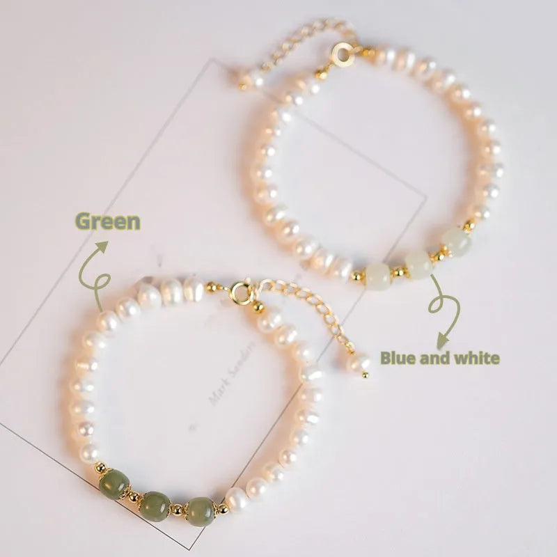 Close-up of a diamond-shaped freshwater pearl bracelet in an electroplated Hetian jade colour on a wrist.
