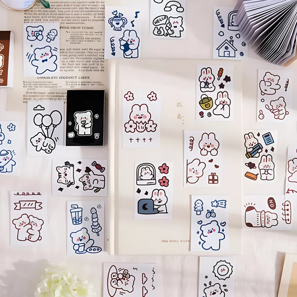 Fifty decorative sticker sheets in Japanese composite paper with cute animal and beverage designs measuring 40x60mm each