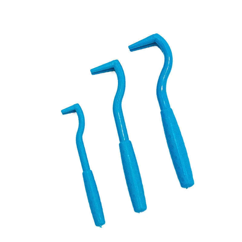 Three plastic tick removal tools with hook design for pets, shown in blue and green colours