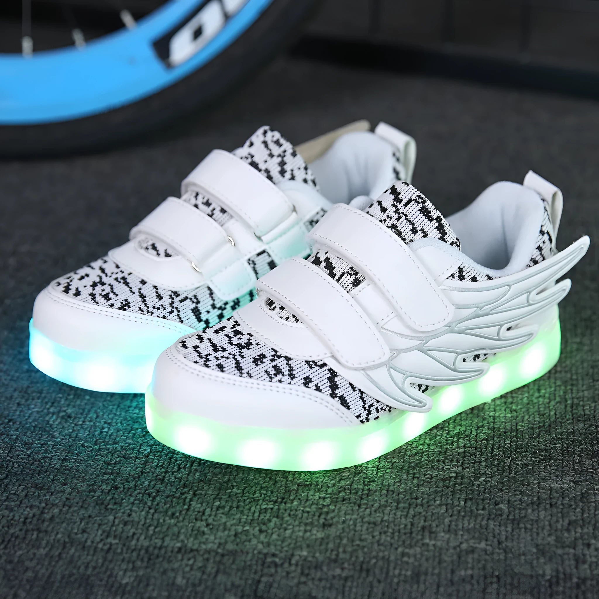 Child wearing plum red USB-rechargeable LED light up sneakers with colourful flashing lights.