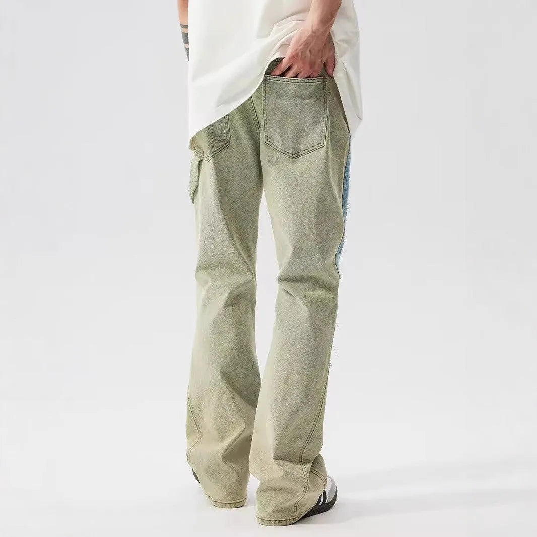 Retro patchwork jeans with splash-ink distressed design in yellow and blue colours