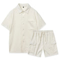 Women's beige polyester two-piece lounge set with short sleeves and elastic waist shorts laid flat.