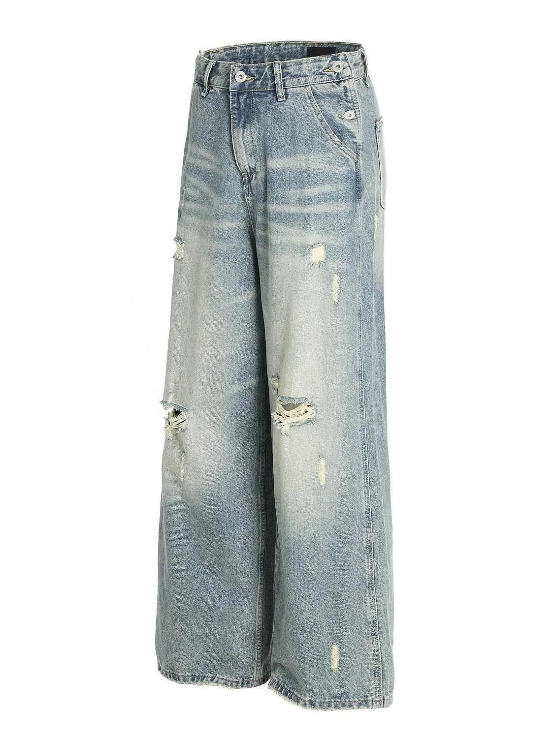 Water washed hole jeans in retro blue with loose straight leg and zip fly for women