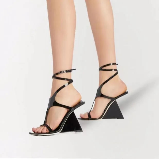 Women's square-toe high-heel sandals with buckle fastening in black colour showing 9.5cm heel