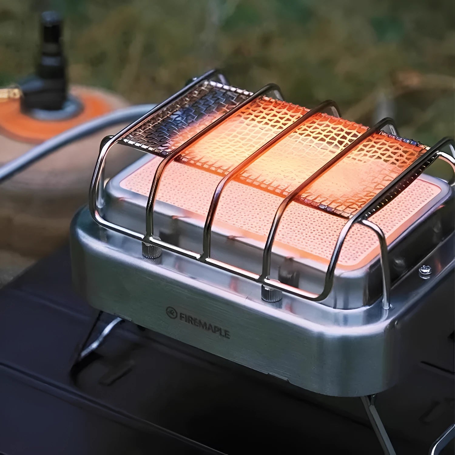 1800W outdoor heating stove with voltage regulator in metal primary colour, shown both expanded and collapsed for storage